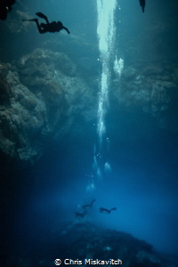 "The Pit" Cenote in Mexico, Divers enter the Halocline be... by Chris Miskavitch 